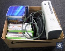 An Xbox 360 with leads,