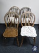 A set of four early 20th century elm spindle back dining chairs