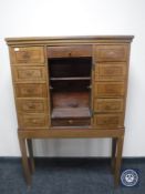 A 19th century continental inlaid oak multi drawer cabinet on stand CONDITION REPORT: