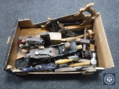 A box of 20th century wood working tools : hand saws, Stanley and other planes,