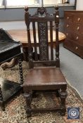 A Victorian carved oak hall chair,