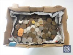 A box containing pre-decimal British and foreign coins