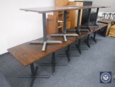 Eleven oak topped and metal based cafe tables plus eight chairs