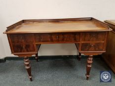 A continental mahogany writing desk fitted five drawers,