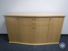 A Skovby shaped front sideboard