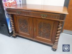 A Victorian mahogany sideboard fitted two drawers with barley twist column supports