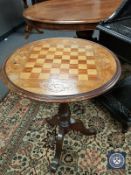 A Victorian mahogany games table,
