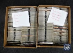 Two boxes containing 7" singles including Rolling Stones, Beatles, Sex Pistols, Queen,