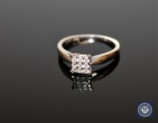 An 18ct white gold six stone diamond square set cluster ring, approximately 0.14ct, size K 1/2.
