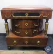 An antique mahogany four drawer Empire style chest with gilt mounts
