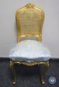 A gilt bergere back bedroom chair in floral fabric