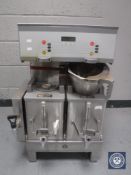 A stainless steel commercial coffee machine