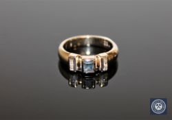 A 14ct white gold diamond and sapphire ring, approximately 0.12ct, size J.