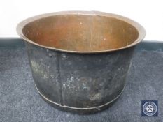 An antique copper cooking pot