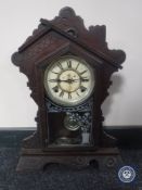 An American eight day striking mantel clock signed The Waterbury Clock Company