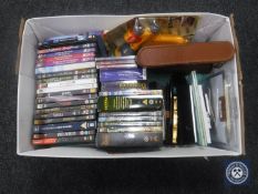 A crate of DVD's, photograph frames, gent's travel set, shoe-shine set, Hozelock gun, etc.