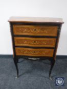 A continental serpentine fronted three drawer chest with metal mounts