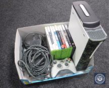 An Xbox 360 with leads,