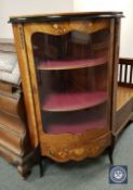 A continental Kingwood, satinwood inlaid and ebonised bowfront glazed display cabinet,