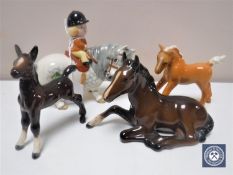A John Beswick figure of a girl on a grey pony together with three further Beswick foals