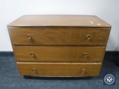 An Ercol elm three drawer chest