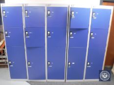 A bank of metal lockers (fifteen doors,