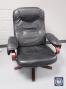 A black leather swivel relaxer chair