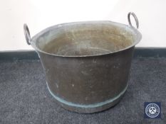 An antique copper cooking pot