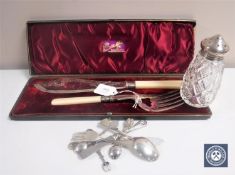 A cased pair of fish servers with silver ferrules,