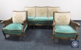 A three piece carved walnut bergere lounge suite