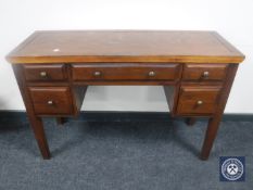 An oak dressing table fitted five drawers