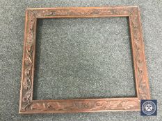 An Edwardian carved oak frame dated 1906