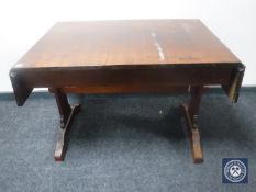 An early 20th century continental flap sided sofa table