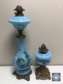 Two antique blue glass hand painted oil lamps on gilt metal bases