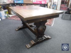 An early 20th century continental oak pull-out refectory dining table