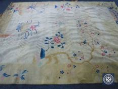 A Chinese style carpet on beige ground