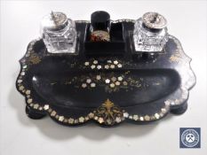 A Victorian mother of pearl inlaid papier mache desk stand with ink wells by Jennings & Betteridge