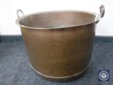 An antique copper cooking pot