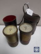 Two brass cased gas leak indicators in leather pouches