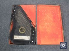 An early 20th century cased Royal harp zither
