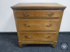 An early 20th century continental oak three drawer chest