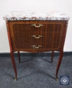 A continental inlaid mahogany three drawer chest with marble top and metal mounts
