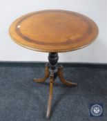 A Victorian inlaid mahogany pedestal occasional table