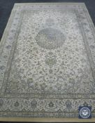 A machine made Persian design carpet on beige ground,