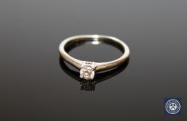 An 18ct white gold round cut diamond solitaire ring, approximately 0.25ct, size P.