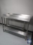 Two narrow stainless steel two tier catering tables