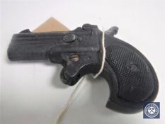 A Derringer style double barrelled starting pistol