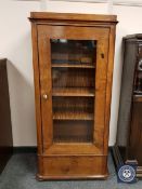 A continental glazed mahogany display cabinet fitted a drawer,