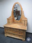 An antique pine dressing chest