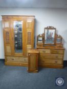 A late Victorian mirror door wardrobe together with matching four drawer dressing chest and pot